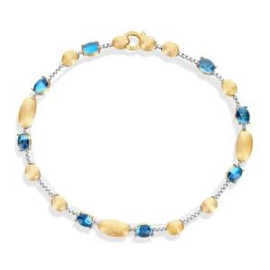 BRACCIALE TENNIS "DANCING AZURE" IN ORO, DIAMANTI E TOPAZIO LONDON BLU
