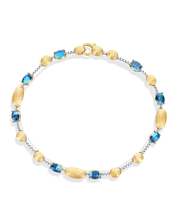 BRACCIALE TENNIS "DANCING AZURE" IN ORO, DIAMANTI E TOPAZIO LONDON BLU